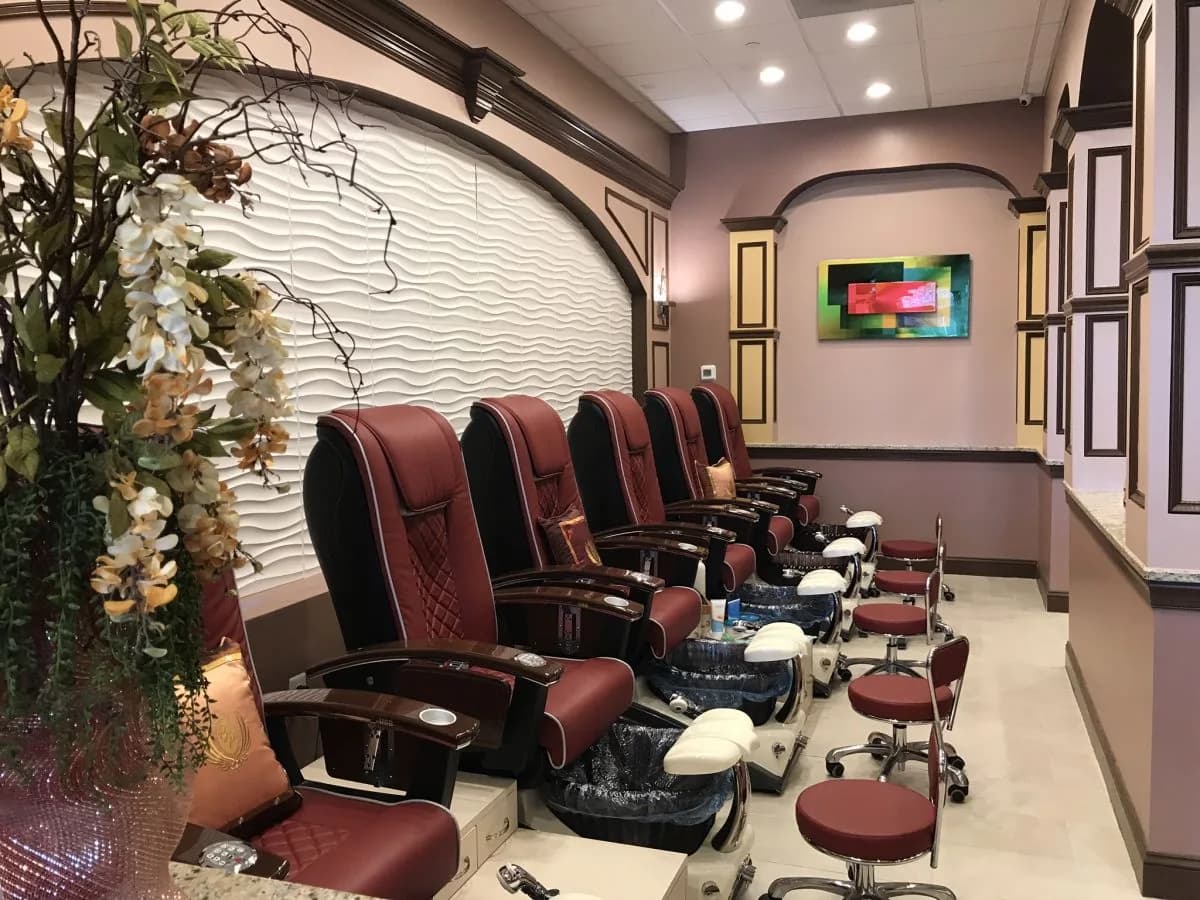 Row of luxury massage pedicure chairs at Belle Palace Nail Spa